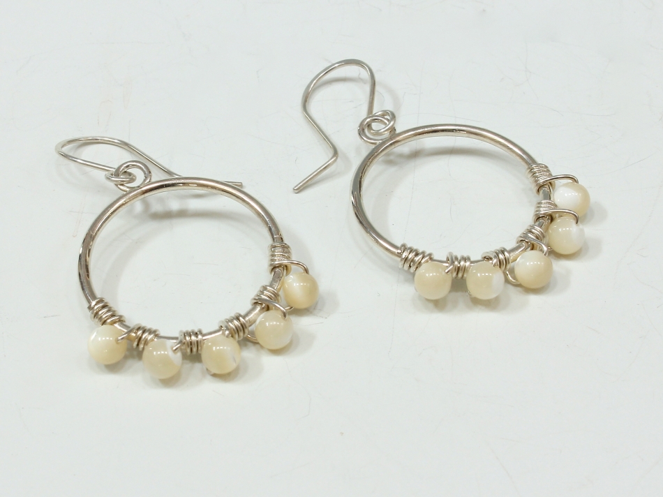 Circle earrings with 5 mother of pearl beads img_3652.jpg