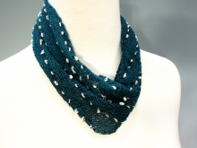 Cowl with freshwater pearls.
